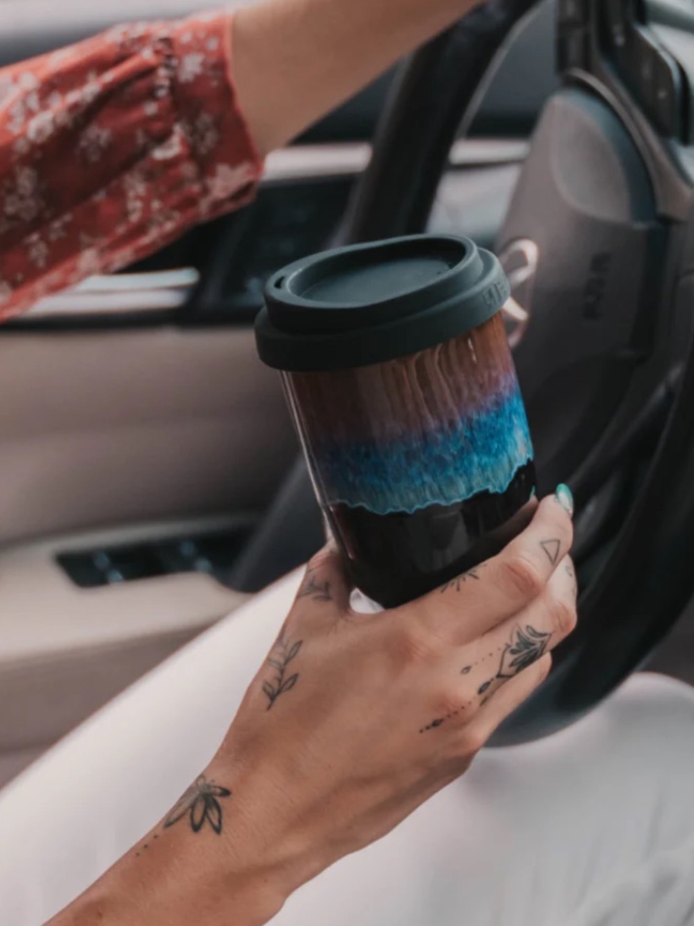 Nova Ceramics Artisian Monsoon 12 Ounce Ceramic Travel Mug.